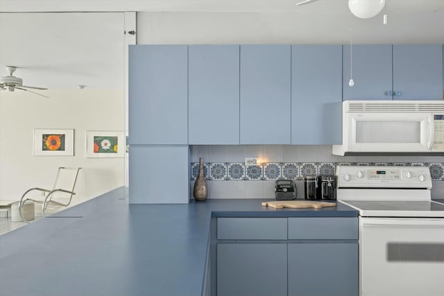 kitchen with ceiling fan, white appliances, blue cabinets, and decorative backsplash