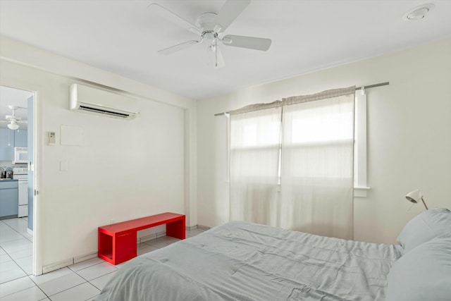 bedroom with a wall unit AC, ceiling fan, and light tile patterned flooring