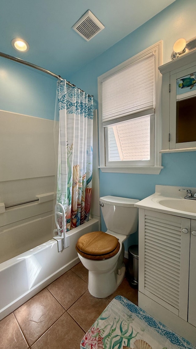 full bathroom with vanity, shower / tub combo with curtain, tile patterned floors, and toilet