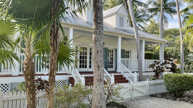 exterior space featuring ceiling fan and a porch