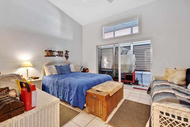 bedroom featuring ceiling fan, high vaulted ceiling, and light tile patterned flooring