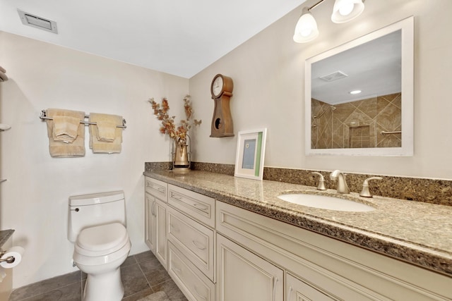 full bathroom featuring visible vents, tiled shower, toilet, tile patterned floors, and vanity