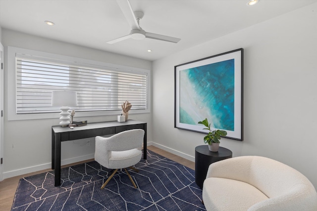 home office featuring baseboards, wood finished floors, and recessed lighting