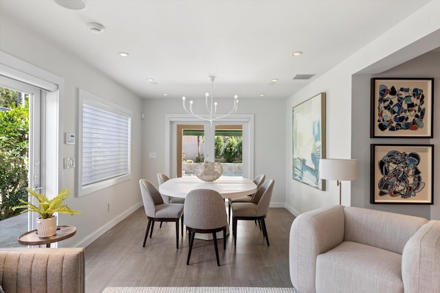 dining area featuring light wood-style floors, a wealth of natural light, baseboards, and recessed lighting