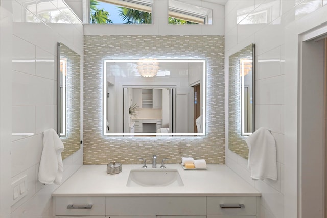 bathroom with vanity and decorative backsplash