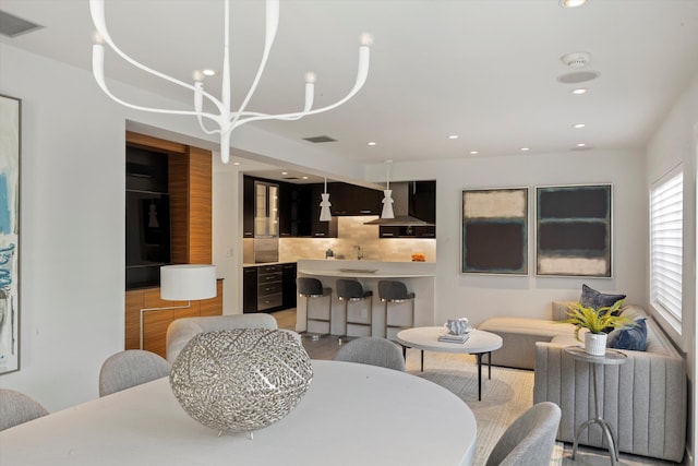 dining space featuring radiator heating unit, visible vents, beverage cooler, and recessed lighting