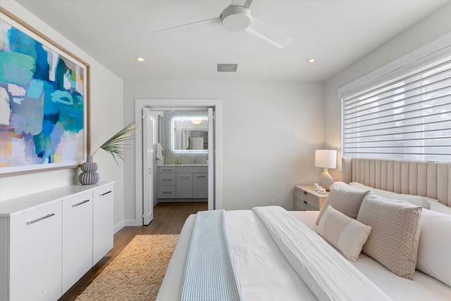 bedroom featuring visible vents, a ceiling fan, wood finished floors, ensuite bathroom, and recessed lighting