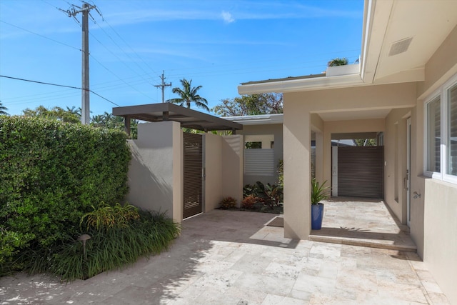 view of patio / terrace featuring fence and a gate