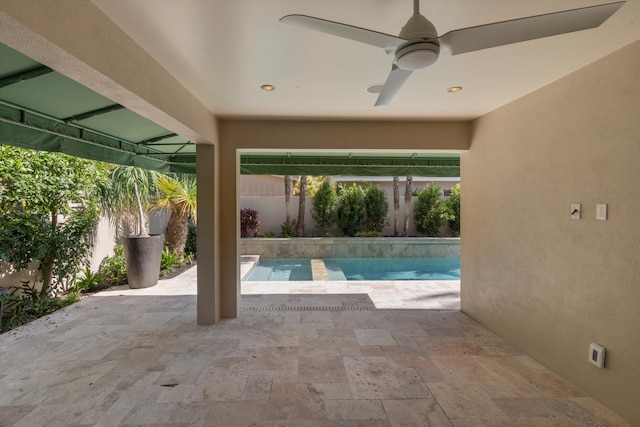 view of swimming pool featuring a fenced backyard, a fenced in pool, a ceiling fan, and a patio