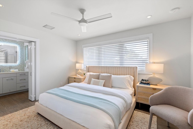 bedroom with visible vents, connected bathroom, a ceiling fan, wood finished floors, and recessed lighting