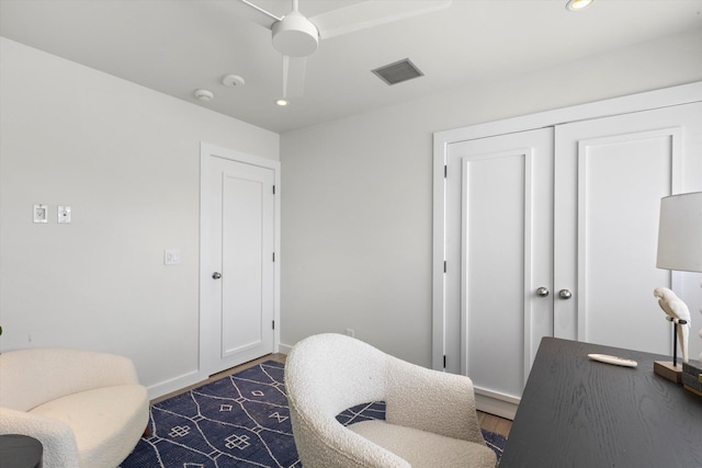 office featuring recessed lighting, visible vents, dark wood finished floors, and baseboards