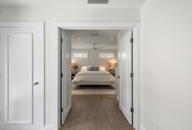 bedroom featuring dark wood finished floors and visible vents