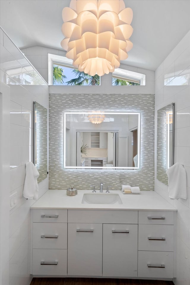 bathroom featuring decorative backsplash and vanity