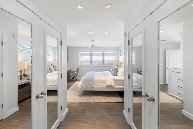 bedroom featuring recessed lighting, wood finished floors, and french doors