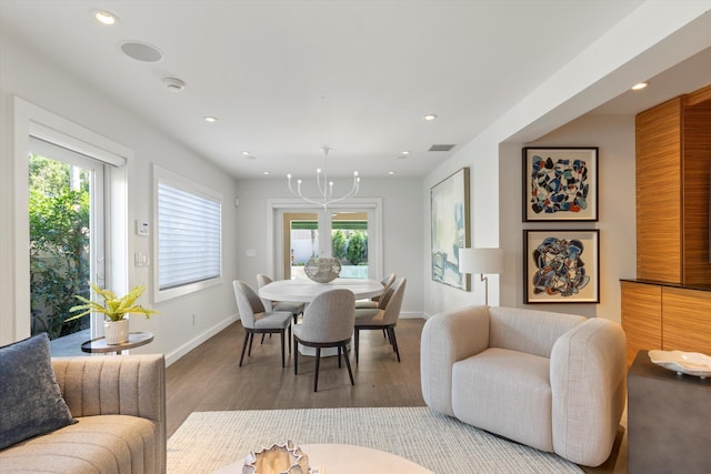 dining space with recessed lighting, visible vents, and wood finished floors