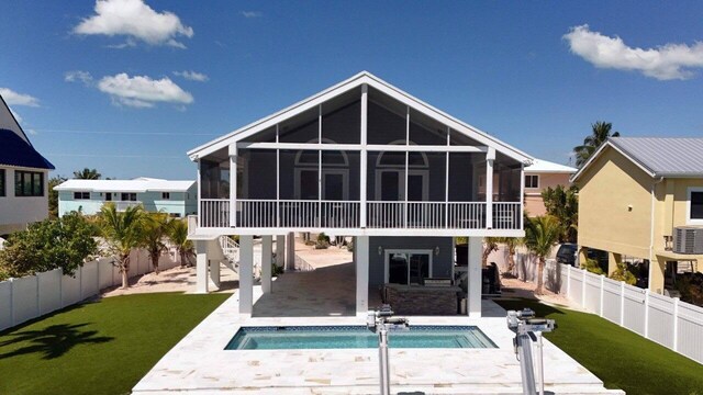 1020 Adams Dr, Key Largo, FL 33037 - back of house featuring a sunroom and a patio