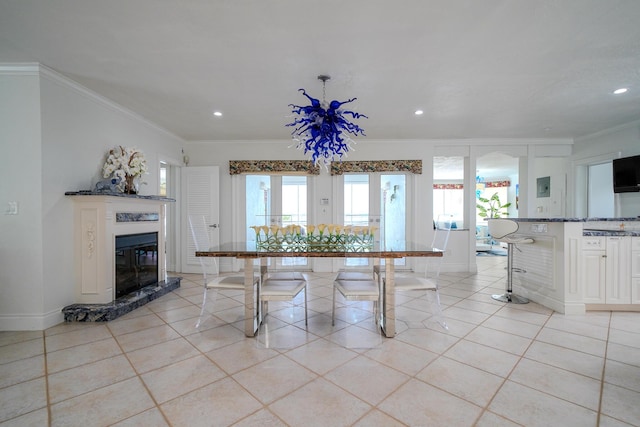 unfurnished dining area with light tile patterned floors, crown molding, and a wealth of natural light