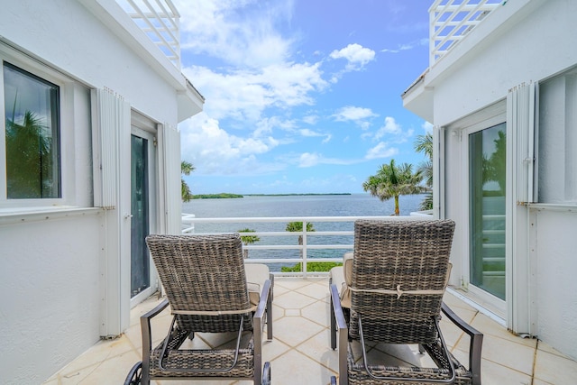 balcony featuring a water view