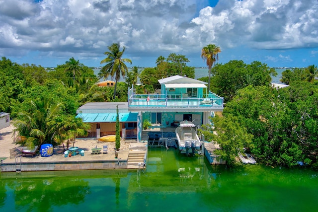 rear view of house with a water view