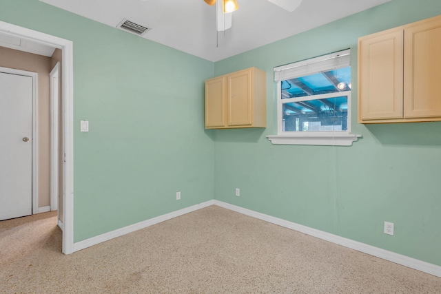 unfurnished room with ceiling fan