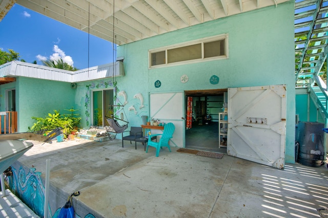 rear view of property with a patio