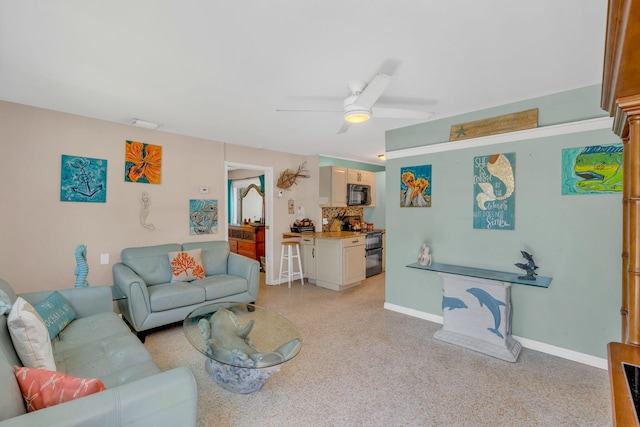 living room featuring ceiling fan