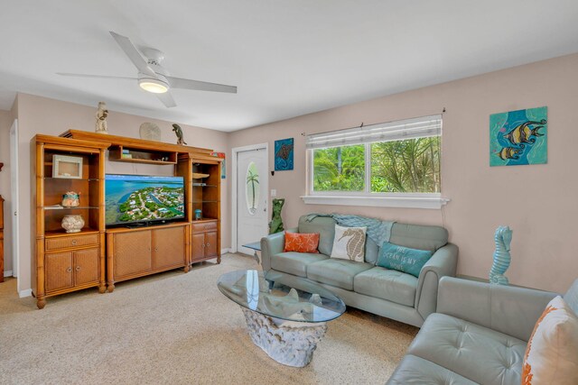 living room with ceiling fan and carpet floors