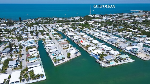 bird's eye view featuring a residential view and a water view