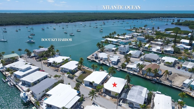 birds eye view of property featuring a water view