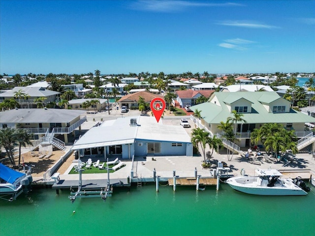 bird's eye view with a residential view and a water view