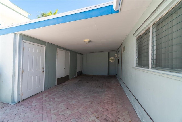 view of patio / terrace with an attached carport