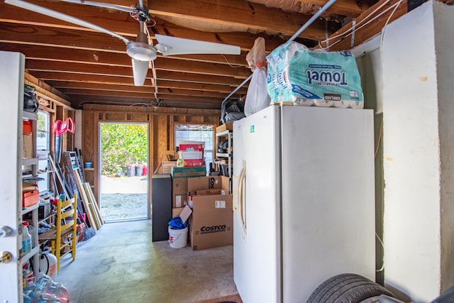 below grade area with freestanding refrigerator