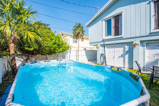 view of swimming pool featuring a fenced in pool and a fenced backyard