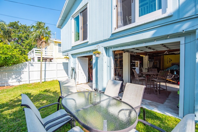 view of patio / terrace featuring outdoor dining area and fence