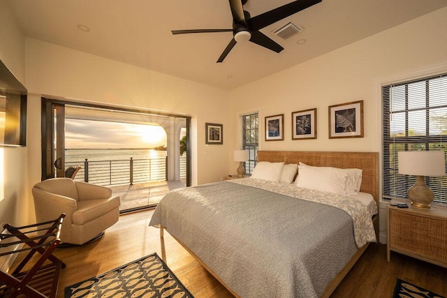 bedroom featuring ceiling fan, hardwood / wood-style floors, and access to outside