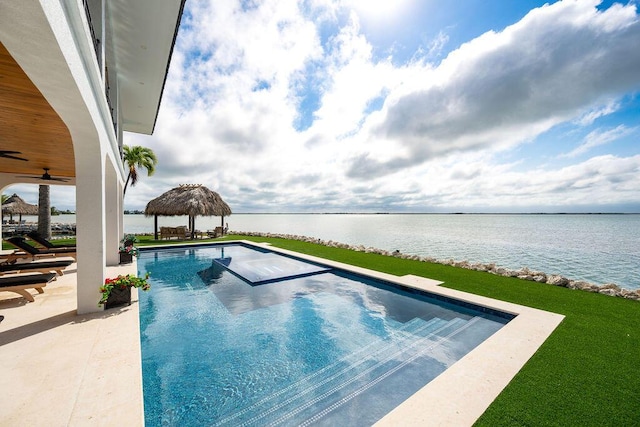 view of swimming pool featuring a gazebo and a water view