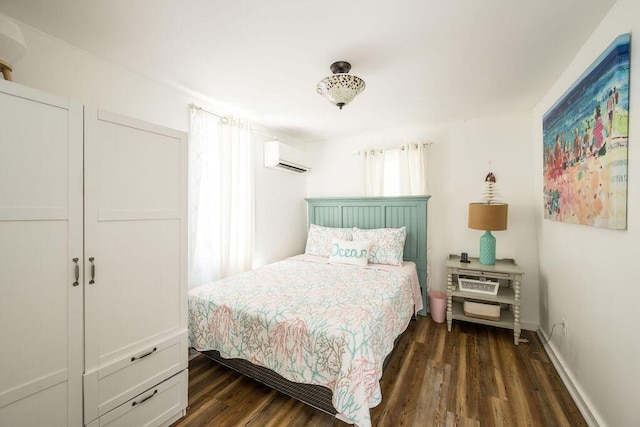421 United St, Key West, FL 33040 - bedroom with an AC wall unit and dark hardwood / wood-style floors
