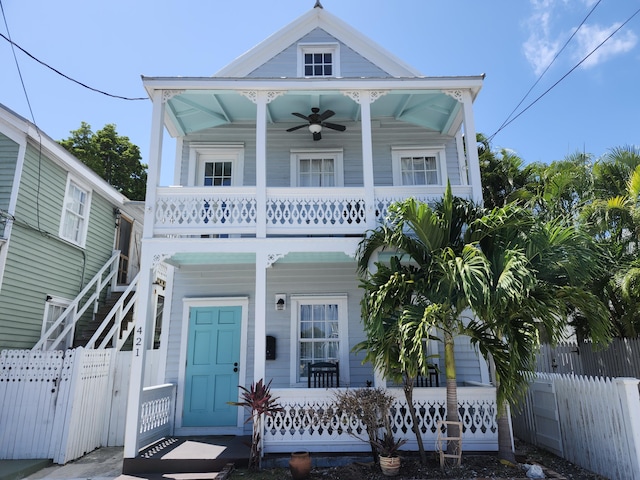 view of front of house featuring a balcony, ceiling fan, and a porch