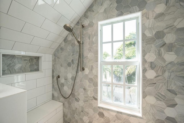 421 United St, Key West, FL 33040 - bathroom featuring vaulted ceiling, a tile shower, and tile walls