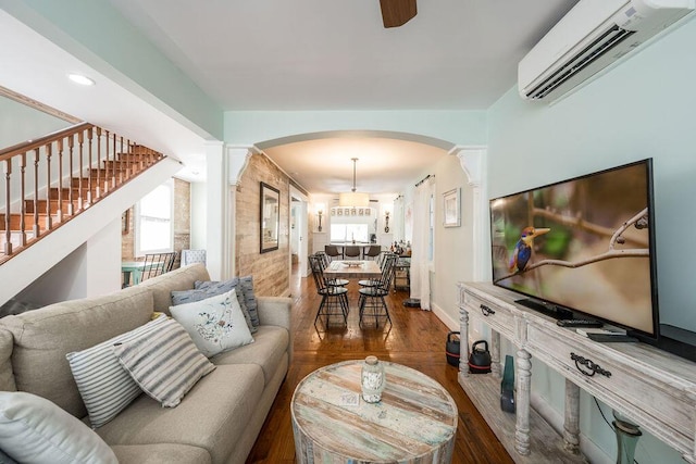 421 United St, Key West, FL 33040 - living room with plenty of natural light, a wall mounted AC, and wood-type flooring