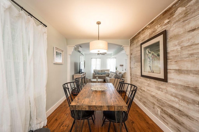 421 United St, Key West, FL 33040 - dining area with hardwood / wood-style flooring, ornate columns, and wood walls