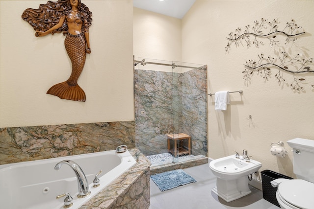 bathroom featuring a relaxing tiled tub, a bidet, and toilet