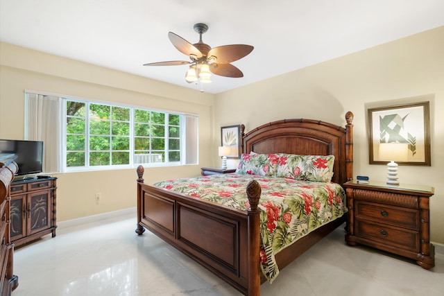 tiled bedroom with ceiling fan