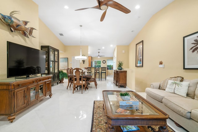 living room featuring lofted ceiling and ceiling fan