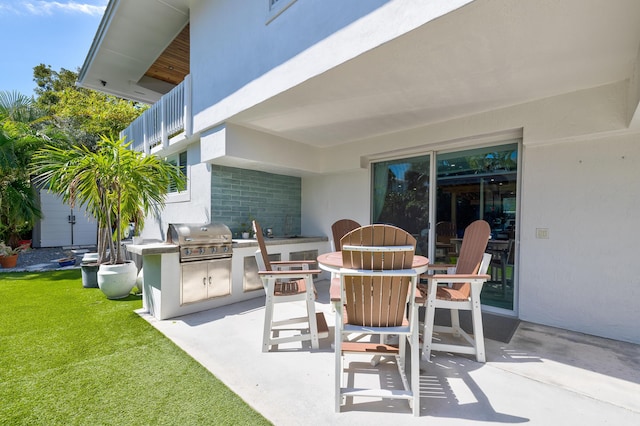 view of patio with a grill and exterior kitchen