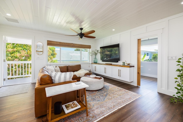 living area with dark wood finished floors, recessed lighting, wooden ceiling, and ceiling fan