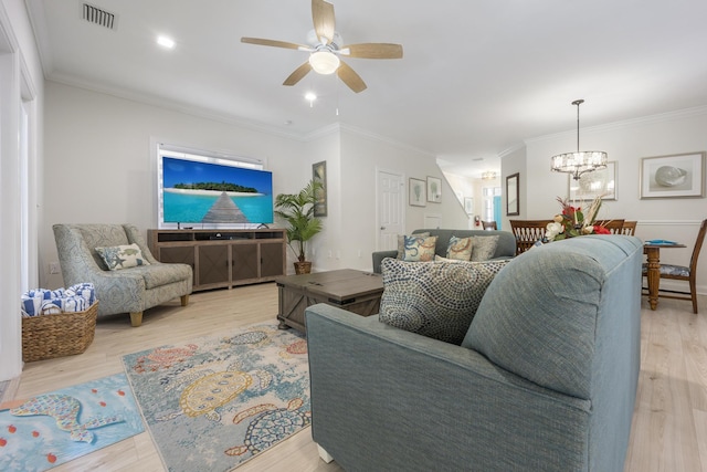 living room featuring crown molding, ceiling fan with notable chandelier, and light wood-type flooring