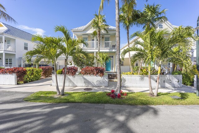 beach home featuring a balcony