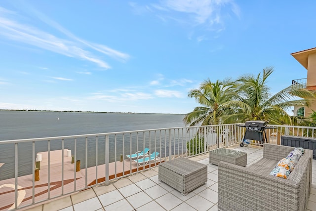 view of patio featuring an outdoor living space, a balcony, a water view, and a grill