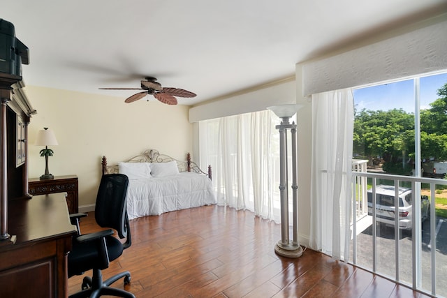 95 Coco Plum Dr Unit 1A, Marathon, FL 33050 - bedroom with access to outside, an office area, dark wood-type flooring, and a ceiling fan